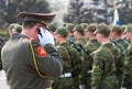 Military officer speaks on mobile phone