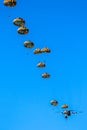 Military parachutist paratroopers jumping out of an air force airplane