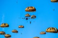 Military parachutist paratroopers parachute jumping out of a air force plane