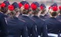 Military parade and girls as members of armed forces and police.