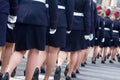 Military parade and girls as members of armed forces and police.