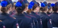 Military parade and girls as members of armed forces and police.