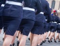 Military parade and girls as members of armed forces and police.