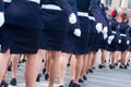 Military parade and girls as members of armed forces and police.