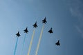 Military parade of 30 years Independence Day of Ukraine. Black silhouettes of six aircrafts flying with color smoke Royalty Free Stock Photo