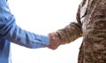 Military and civilian shaking hands standing on white background Royalty Free Stock Photo