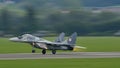 Military plane take off with full afterburner. Close-up panning with copy space Royalty Free Stock Photo