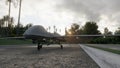 A military predator drone stands on the road and prepares for takeoff. The image is for military, the weapon or spying