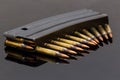 Military rifle bullets On a black background Royalty Free Stock Photo