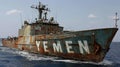 Military rusty ship in the middle of the sea with the inscription Yemen