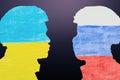 military silhouettes and flags of Russia and Ukraine painted on paper. Russian versus Ukraine trade third world war