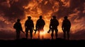 The military silhouettes of soldiers hold gun against with sunset sky background