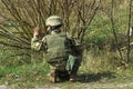 Military soldier at tactical exercises give a sign