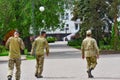 Military soldiers in the dismissal without a weapon walk around the city