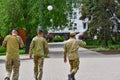 Military soldiers in the dismissal without a weapon walk around the city