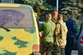 Military soldiers inspect civilian cars to prevent terrorist attacks