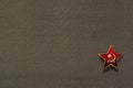 Military soviet star with hammer and sickle on fabric background Royalty Free Stock Photo