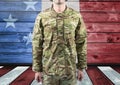 Military standing against american flag Royalty Free Stock Photo