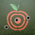 Military target in the form of fruit apple. Metal background wit Royalty Free Stock Photo