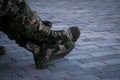 Military training boots on fragmental rocks Royalty Free Stock Photo