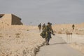 MILITARY TRAINING ZONE. Israeli soldiers walking through the territory of Masada fortification after war games. Masada