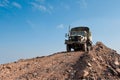 Military Truck on a Dirt Hill Royalty Free Stock Photo