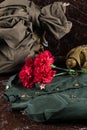 Military uniform bag and flowers, concept for greeting