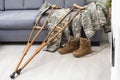 military uniform with crutches. disability