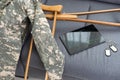 military uniform with crutches and a tablet