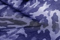 Military uniform pattern with blur effect in blue tone. Royalty Free Stock Photo