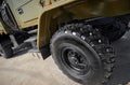 Military vehicle truck wheels on hub with black shine tires. New clean off road transport truck all terrain wheels for. High resol Royalty Free Stock Photo