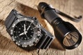 Military watch and flashlight Royalty Free Stock Photo