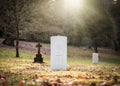 Military white British World War One grave with no inscription unknown soldier alone with sun rays shining peaceful and tranquil Royalty Free Stock Photo