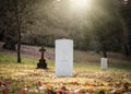 Military white British World War One grave with no inscription unknown soldier alone with sun rays shining peaceful and tranquil Royalty Free Stock Photo