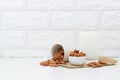 Milk Almonds in a glass on white background