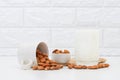 Milk Almonds in a glass on white background