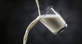 Milk being poured into a glass Royalty Free Stock Photo