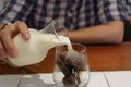 Milk Being Poured Into Glass Iced Coffee.