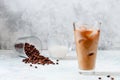 Milk Being Poured into Iced Coffee in Tall Glass on Light Grey Background. Concept Refreshing Summer Drink Royalty Free Stock Photo