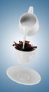 Milk being poured into small cup of coffee. 3d