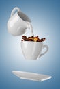 Milk being poured into small cup of coffee. 3d Royalty Free Stock Photo