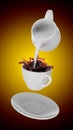 Milk being poured into small cup of coffee. 3d