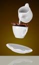 Milk being poured into small cup of coffee. 3d Royalty Free Stock Photo
