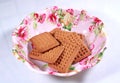 Milk biscuits in a designed colourful food plate.