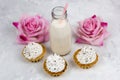 milk bottle, roses, sweet cupcakes Royalty Free Stock Photo