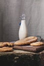 Milk bottle and sweet pastry Royalty Free Stock Photo