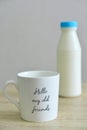 Milk bottle and a white mug