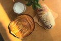 Milk and bread, sunlight on wooden table, top view, healthy nutrient breakfast Royalty Free Stock Photo