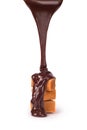 Milk caramel candyes and chocolate pourung isolated Royalty Free Stock Photo