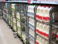 Milk cartons on a supermarket shelf.